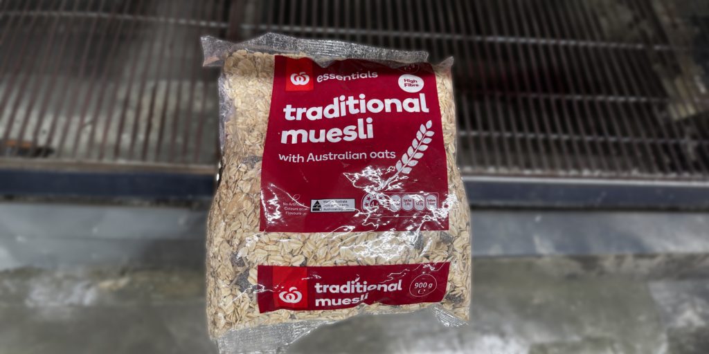 Woolworths brand Muesli on shelf.